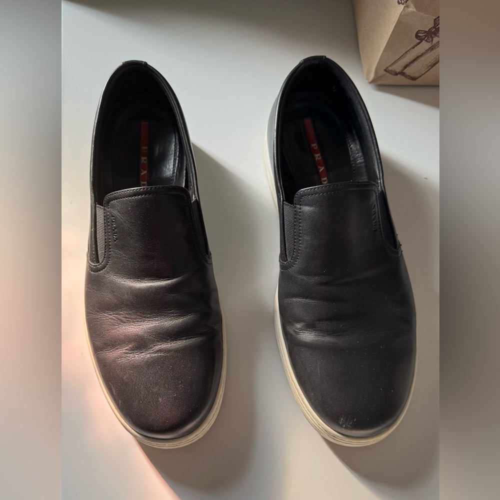 Prada Men's Black Slip-On Loafers..
Fit large I’m 10.5 - 11 and fit perfectly. - Picture 7 of 8